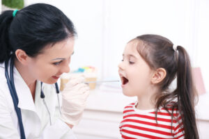 Child getting throat swabbed
